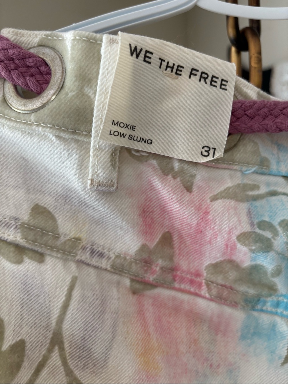 We The Free floral low-slung jeans in white with pink and blue washes